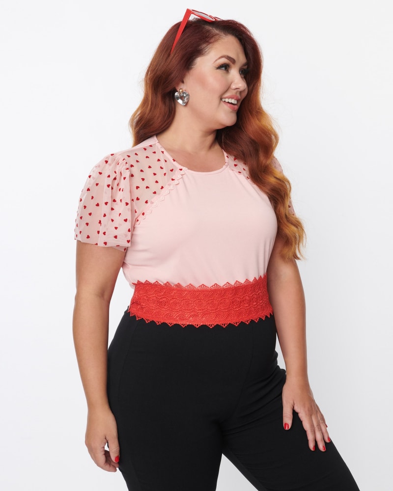 Front of a model wearing a size 3X/20 Unique Vintage Plus Size Pink & Red Hearts Mesh Sleeve Top in Pink & Red by Unique Vintage. | dia_product_style_image_id:270111